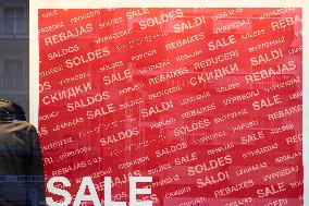 Multilingual Sale Sign In A Storefront