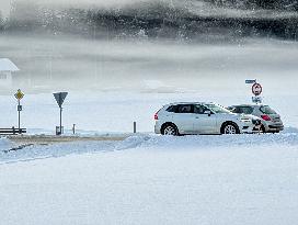 Two Cars On A Slippery And Icy Road