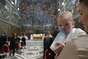 Pope Francis Conducts Baptisms - Vatican