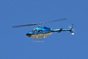 Diverse helicopters in flight