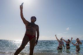 Winter Swimmers Celebrate The New Year On A Beach In Athens