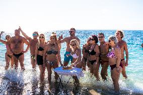 Winter Swimmers Celebrate The New Year On A Beach In Athens