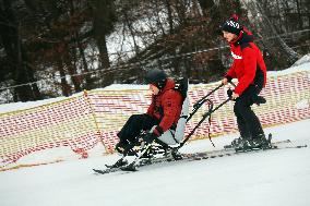 Ukrainian war veterans visit adaptive skiing training session in Kyiv