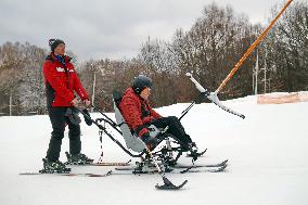 Ukrainian war veterans visit adaptive skiing training session in Kyiv