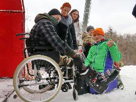 Ukrainian war veterans visit adaptive skiing training session in Kyiv