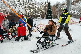 Ukrainian war veterans visit adaptive skiing training session in Kyiv