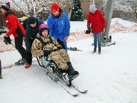 Ukrainian war veterans visit adaptive skiing training session in Kyiv