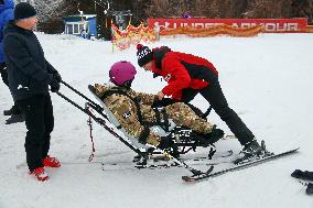 Ukrainian war veterans visit adaptive skiing training session in Kyiv