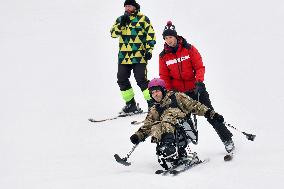 Ukrainian war veterans visit adaptive skiing training session in Kyiv