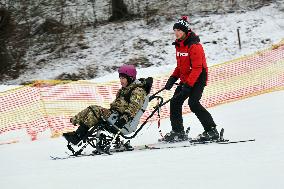 Ukrainian war veterans visit adaptive skiing training session in Kyiv