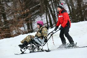 Ukrainian war veterans visit adaptive skiing training session in Kyiv