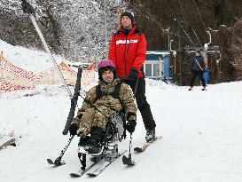 Ukrainian war veterans visit adaptive skiing training session in Kyiv