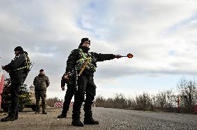 Ukrainian police officers at roadblock in Zaporizhzhia region