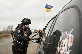 Ukrainian police officers at roadblock in Zaporizhzhia region