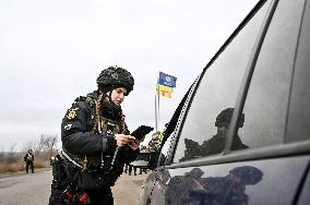 Ukrainian police officers at roadblock in Zaporizhzhia region