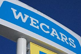 Logo and signage for WECARS Co., Ltd.