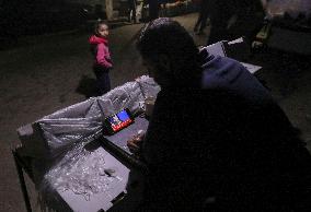 Displaced Residents Follow the News - Gaza