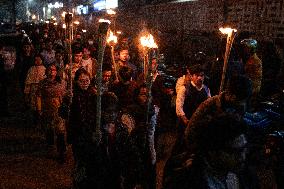 Torch Procession To Protest Attack
