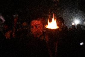 Torch Procession To Protest Attack