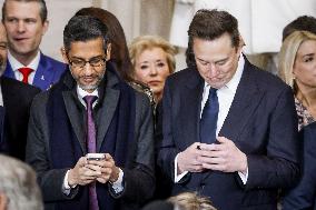 Elon Musk Holds His Phone At Trump Inauguration - DC