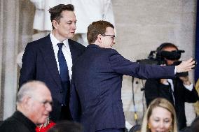 Elon Musk Holds His Phone At Trump Inauguration - DC