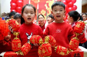 Children Learning Folk Customs to Welcome Chinese Lunar New Year