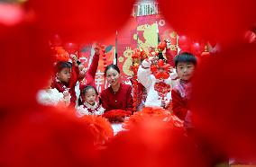 Children Learning Folk Customs to Welcome Chinese Lunar New Year