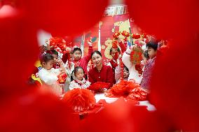 Children Learning Folk Customs to Welcome Chinese Lunar New Year