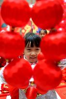 Children Learning Folk Customs to Welcome Chinese Lunar New Year