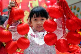 Children Learning Folk Customs to Welcome Chinese Lunar New Year