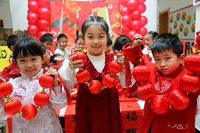 Children Learning Folk Customs to Welcome Chinese Lunar New Year