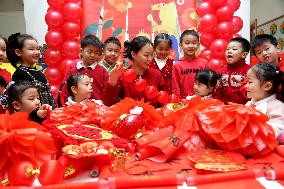 Children Learning Folk Customs to Welcome Chinese Lunar New Year