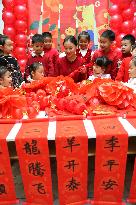 Children Learning Folk Customs to Welcome Chinese Lunar New Year