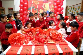 Children Learning Folk Customs to Welcome Chinese Lunar New Year
