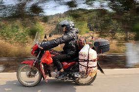 Migrant Workers Ride Motorcycles Home For Chinese Lunar New Year