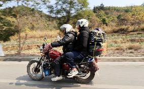 Migrant Workers Ride Motorcycles Home For Chinese Lunar New Year