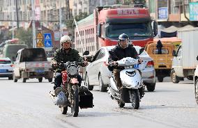 Migrant Workers Ride Motorcycles Home For Chinese Lunar New Year