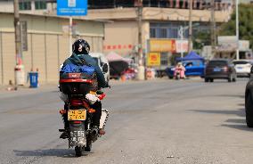 Migrant Workers Ride Motorcycles Home For Chinese Lunar New Year