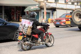 Migrant Workers Ride Motorcycles Home For Chinese Lunar New Year