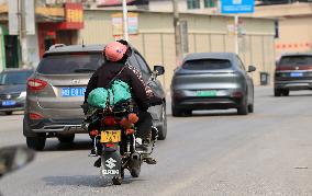 Migrant Workers Ride Motorcycles Home For Chinese Lunar New Year