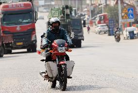 Migrant Workers Ride Motorcycles Home For Chinese Lunar New Year