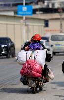 Migrant Workers Ride Motorcycles Home For Chinese Lunar New Year