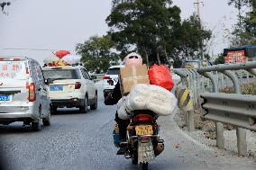 Migrant Workers Ride Motorcycles Home For Chinese Lunar New Year