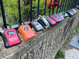 Realtor Locks Affixed To A Fence In Downtown Toronto, Canada