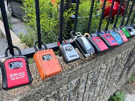 Realtor Locks Affixed To A Fence In Downtown Toronto, Canada