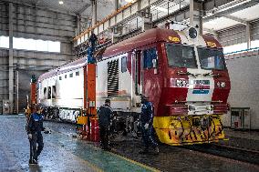 Maintenance Workers Fix Locomotive Parts - Nairobi