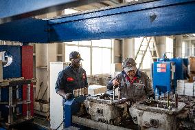 Maintenance Workers Fix Locomotive Parts - Nairobi