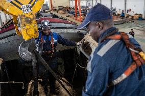 Maintenance Workers Fix Locomotive Parts - Nairobi