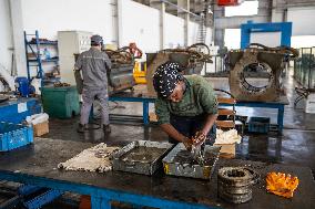 Maintenance Workers Fix Locomotive Parts - Nairobi