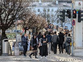 Tourists Sightseeing In Salzburg